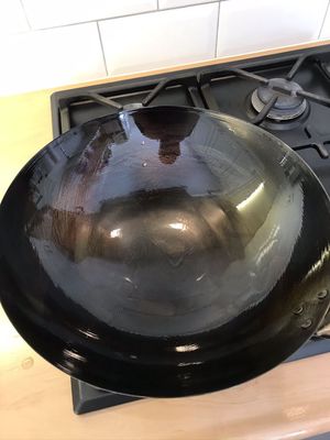 Hoe moet je een wok inbranden?